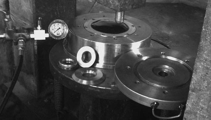 th International Mechanical Engineering Forum Prague 212, 2-22 February 212, Prague Czech Fig. 1 The hydroforming process assisted by a floating disk Fig. 2 Tools and hydraulic press Tab.