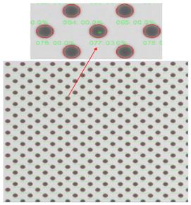 The x-ray image of a die on a reflowed wafer, which demonstrates that the number of bump voids (green) is quite low and the size of a typical void is 3% of the bump