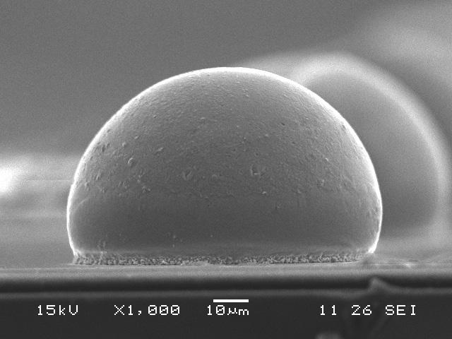 Solder bumps reflowed from 200 mm mechanical wafers (see photos below) under EA have a very smooth surface and spherical shape, driven by a high surface tension