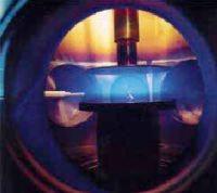 The ions are generated in a plasma: which is an ionised gas (a mixture of electrons and