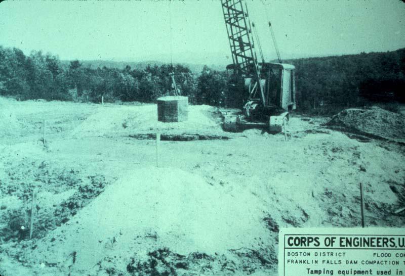 An experimental program of compaction by dropping a heavy concrete block was done by the U.S.