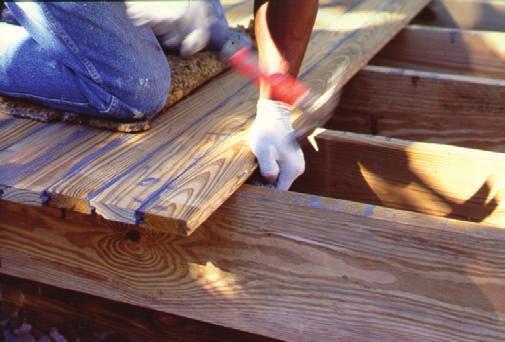 trim moulding ½ gap at wall 1 overhang lattice skirt moisture barrier When installing the porch flooring material, begin with a coat of paintable water-repellent sealer to all four sides and the