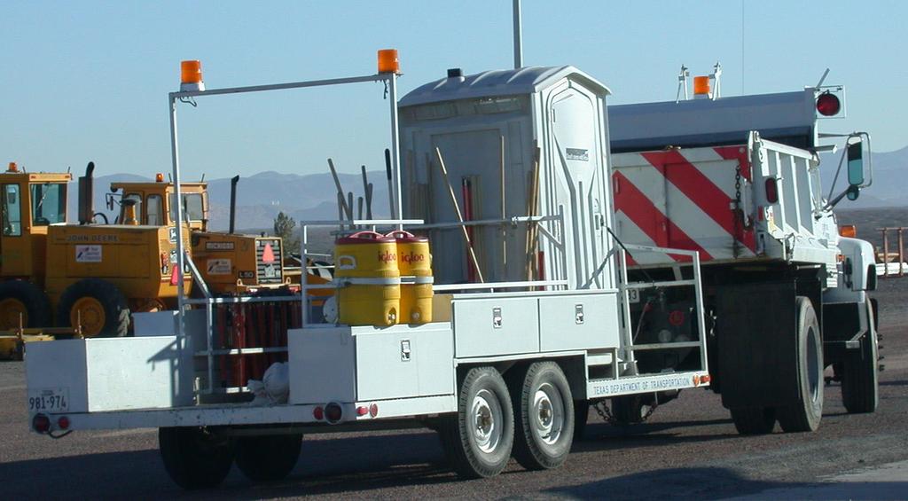 Figure 10. Dump Truck with Trailer for Litter Pickup. El Paso District Researchers observed sign maintenance operations on a variety of facilities in the El Paso District.