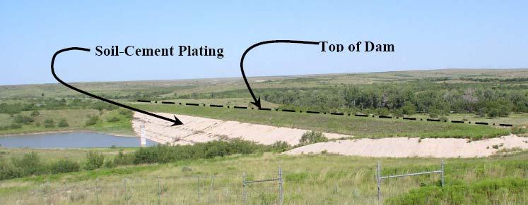 These dams are typically less than 50 feet high with 3.5:1 (horizontal:vertical) front and back slopes. Photo 1 shows one of the dams in the study group.