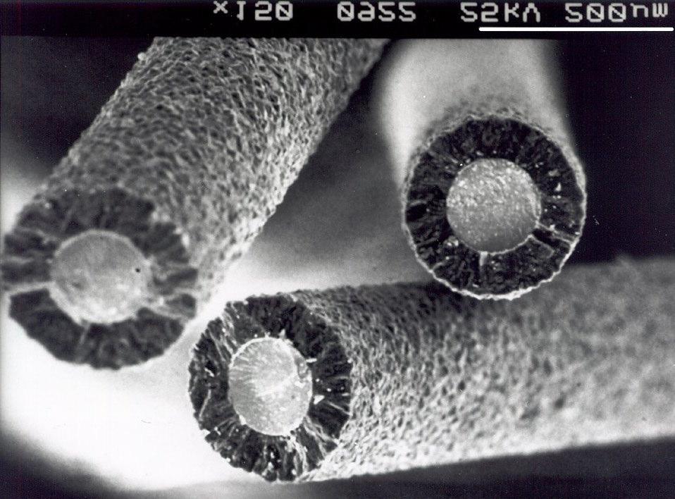 Figure 1. Electron micrograph showing some of the diamond fibres used in the PMCs. The W cores are 100 µm in diameter, with 50 µm of diamond deposited around them.