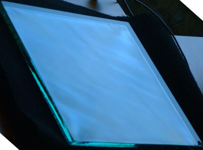 The same 12 inch square of 12 mm tempered glass much more readily shows the quench pattern under the