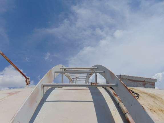 Shell/roof access ladder in above photos is not equipped with anti-skid rungs and is only 15