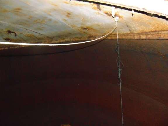 Photo shows the condition of the interior roof. Notice the rust forming at the roof seams.
