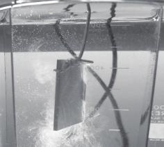Anodization of Magnesium Alloys Using Phosphate Solution Solution 223 3 Lead Lead Bubble Anode (Specimen) Cathode (Stainless steel) Spark Fig. 2. Appearance of specimen during anodization ( immediately after initiation of electrolysis, sparks on substrate).