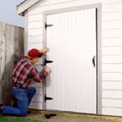 8) Install the Doors >Use stock double doors, or build one large door on site out of plywood or boards jointed on a braced back frame.