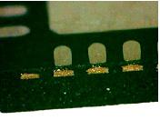 The lead end is slightly recessed from the package perimeter due to a half-etched lead frame. No solder fillet is expected after the solder reflow process.