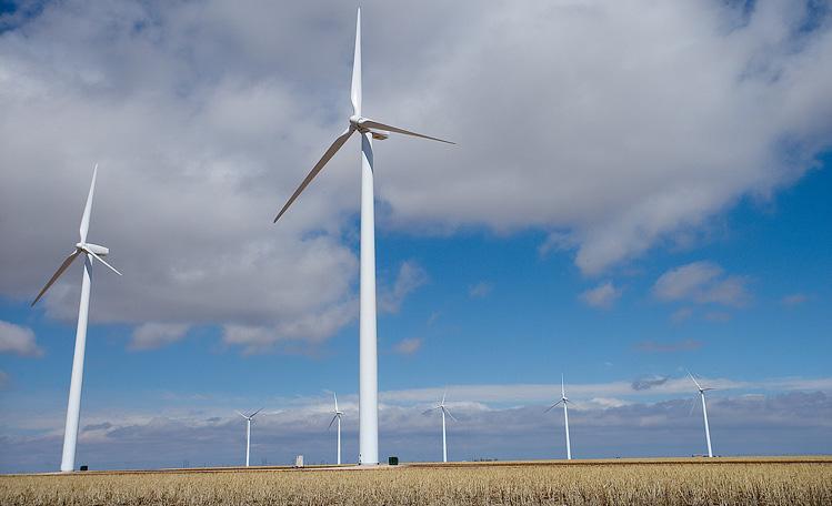 On this wind farm, turbines stand 243 feet high and produce enough power for nearly 3,000 homes.
