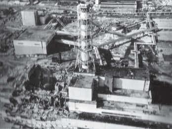 A 1986 aerial view of the destroyed Unit 4 at Chernobyl (left), and the start of construction of the original sarcophagus al.