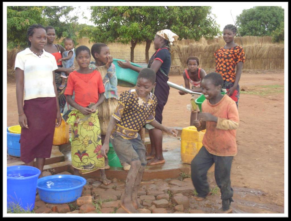 Mothers and children at water source placed near health post in Niassa Province, Tanzania.