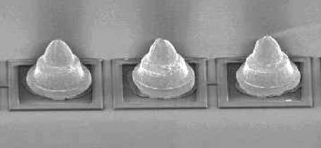 Figure 5 Photograph of wire-ball bumps. Figure 6 Photograph of plated bumps. 4.