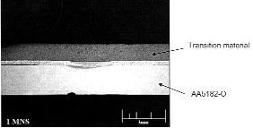 Fig. 4 Weld cross section at 4 cycles weld time: no melting observed. The steel sheet separated from the transition sheet due to short weld time. Fig.