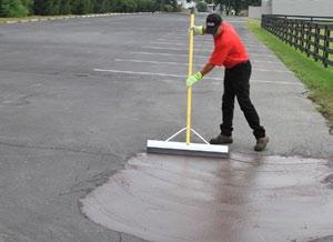 cutting out and removing the damaged asphalt, repairing the