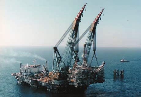 DEVELOPMENT OF OFFSHORE FIELDS Fig. 11. Installing the deck: lifting with a crane barge (Eni-Saipem). towed to the offshore site, where the vessel used for installation is already in place.