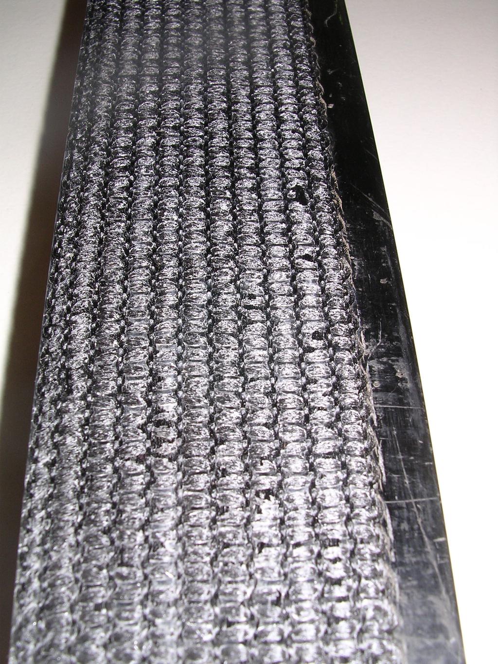 Figure 5 Increase surface roughness has been achieved in development of a slightly thicker CFRP Bar (8mm) Load cycles were built up whilst monitoring ram extension