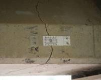 (c) Figure 8: Cracks in AASHTO Type I girder; Cracks ready to be filled; (c)application of SFRP on concrete beam; (d) A repaired section of Hart County bridge (d)