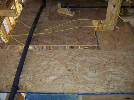 The walk surface decking in the attic that leads to the heating units is made of 7/16 inch OSB in some areas.