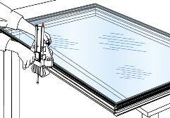Once proper alignment is achieved, apply light pressure to the corners where the protective liner has been removed from the tape. The frame should remain in place after the light pressure application.