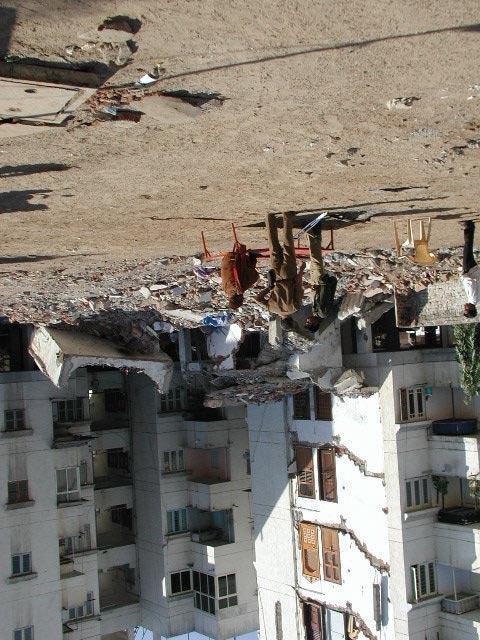 5, where half of the building (in the foreground) collapsed. Since there were several causalities, most of the building debris was removed by the time the EERI team reached the site. Figure 5.