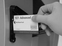 Figure 1. Ease of protocol setup using EZ1 Cards. Inserting an EZ1 Card, containing a protocol, into an EZ1 instrument. The instrument should only be switched on after an EZ1 Card is inserted.