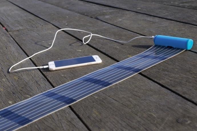 Thin, flexible organic photovoltaic panel and charges phone or battery