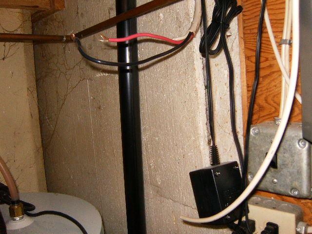 An extension cord is being used and is a safety hazard. Repair: Abandoned wiring should be replaced or appropriately terminated. Wires were hanging at the main panel, not powered.