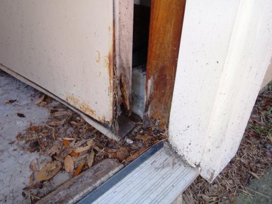 Doors Repair: The side service door to the garage has rust and water damage to the bottom of the door and