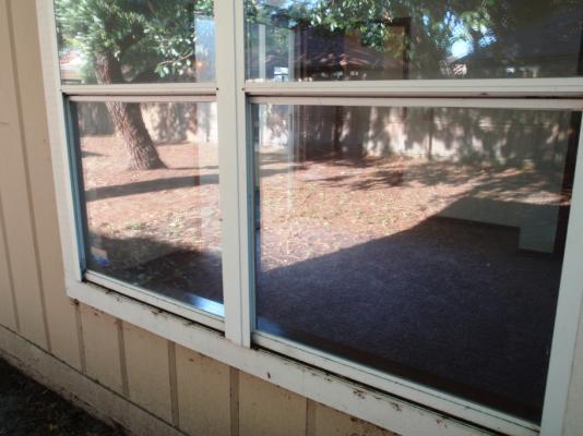 Windows Repair: The front bedroom window is broken out and was closed by adding