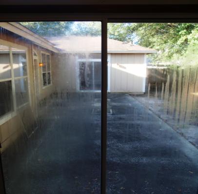 123 Main Street, Anytown, FL 12345 Page 30 of 38 Repair: The glass of the sliding glass door in the