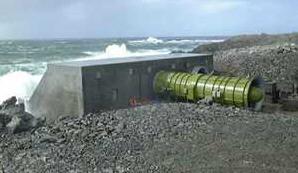 At a wave power station, the waves arriving cause the water in the chamber to rise and fall, which means that air is forced in and out of the hole in the top of the chamber.