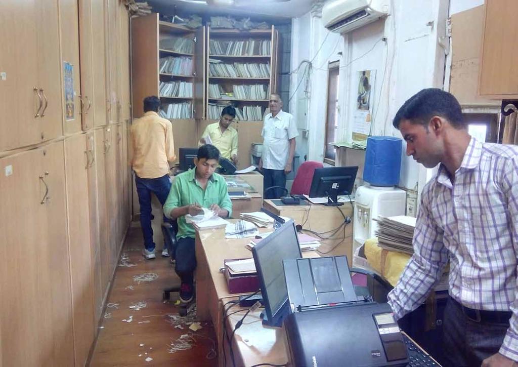 India A small step towards digitization; a giant leap for Digital Customs A group of officials, hard at work digitizing paper documents.