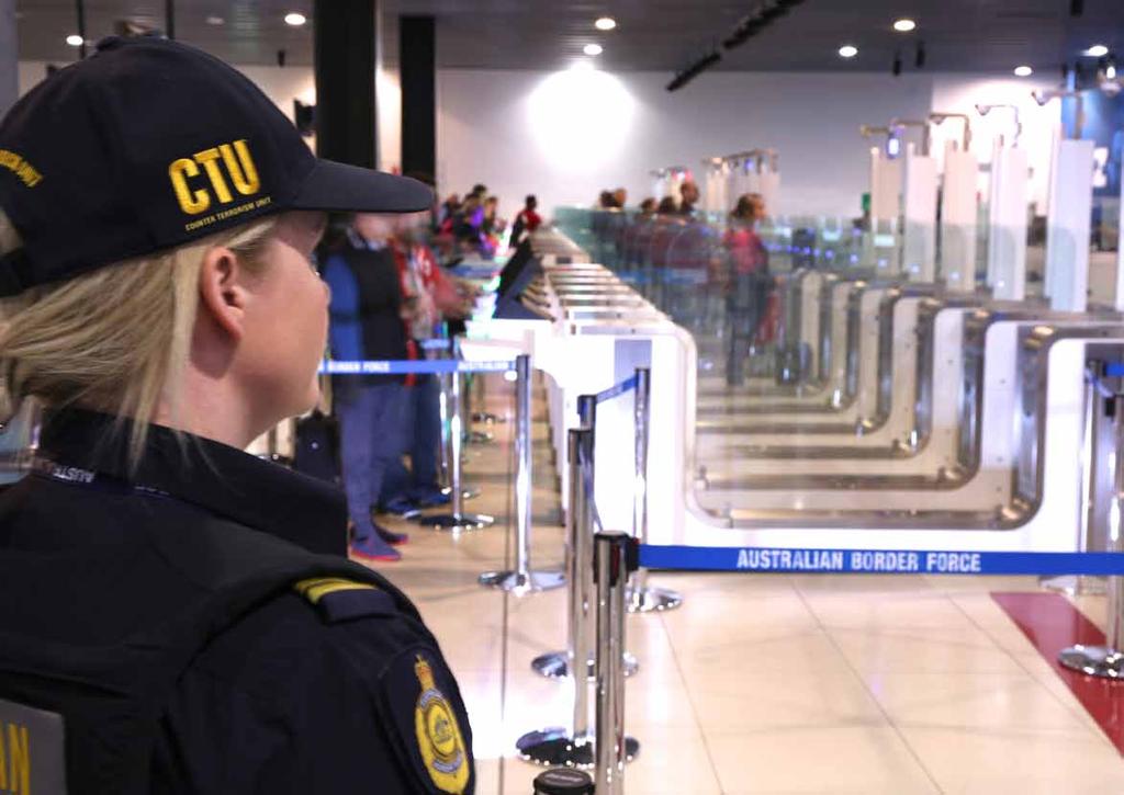 Australia World first technology for traveller facilitation A member of the Counter Terrorism Unit (CTU) observes departing travellers being processed through automatic gates called Departures
