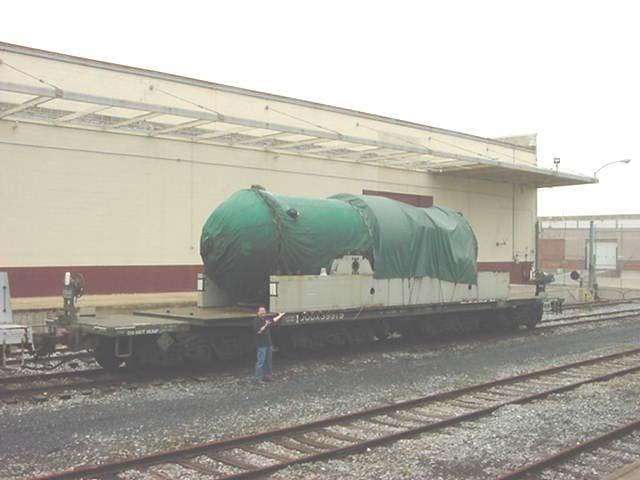 New Component Flatcar and Shipping Container Large, heavy self-protecting.