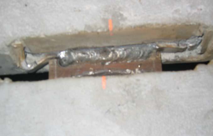 The performance of the connector was characterized by bending and plastic deformation of the legs near where they become embedded in the concrete.