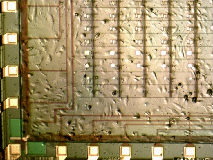 The top layer of the PCB has spring-loaded Au contact pins that contact the exposed pads at the edges of the wafer. Figure 11.