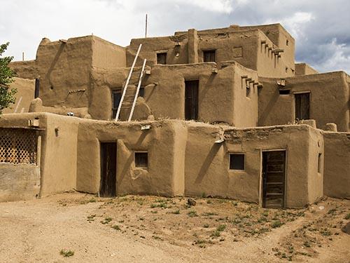 The Pueblo and Auasazi Indians faced their buildings directly south and used material that would store heat