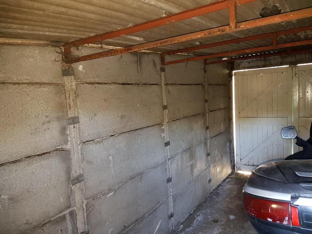 The garage wall and roof panels are
