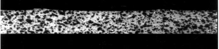 Fig. 1 Typical high-contrast pattern used for digital image correlation as applied to a transverse weld tensile specimen. Fig.