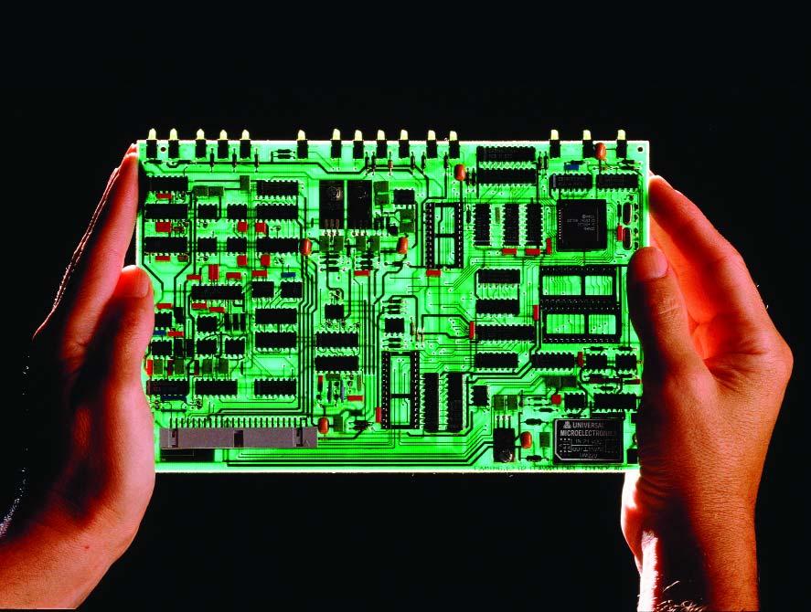 A chemical process called etching is used to create the copper paths on the circuit board.