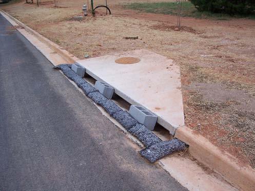 Protecting Culvert and Channel Inlets and Outlets 45 sides and/or top to protect against incoming flow pressures. Make sure fence is trenched in and securely fastened to posts.