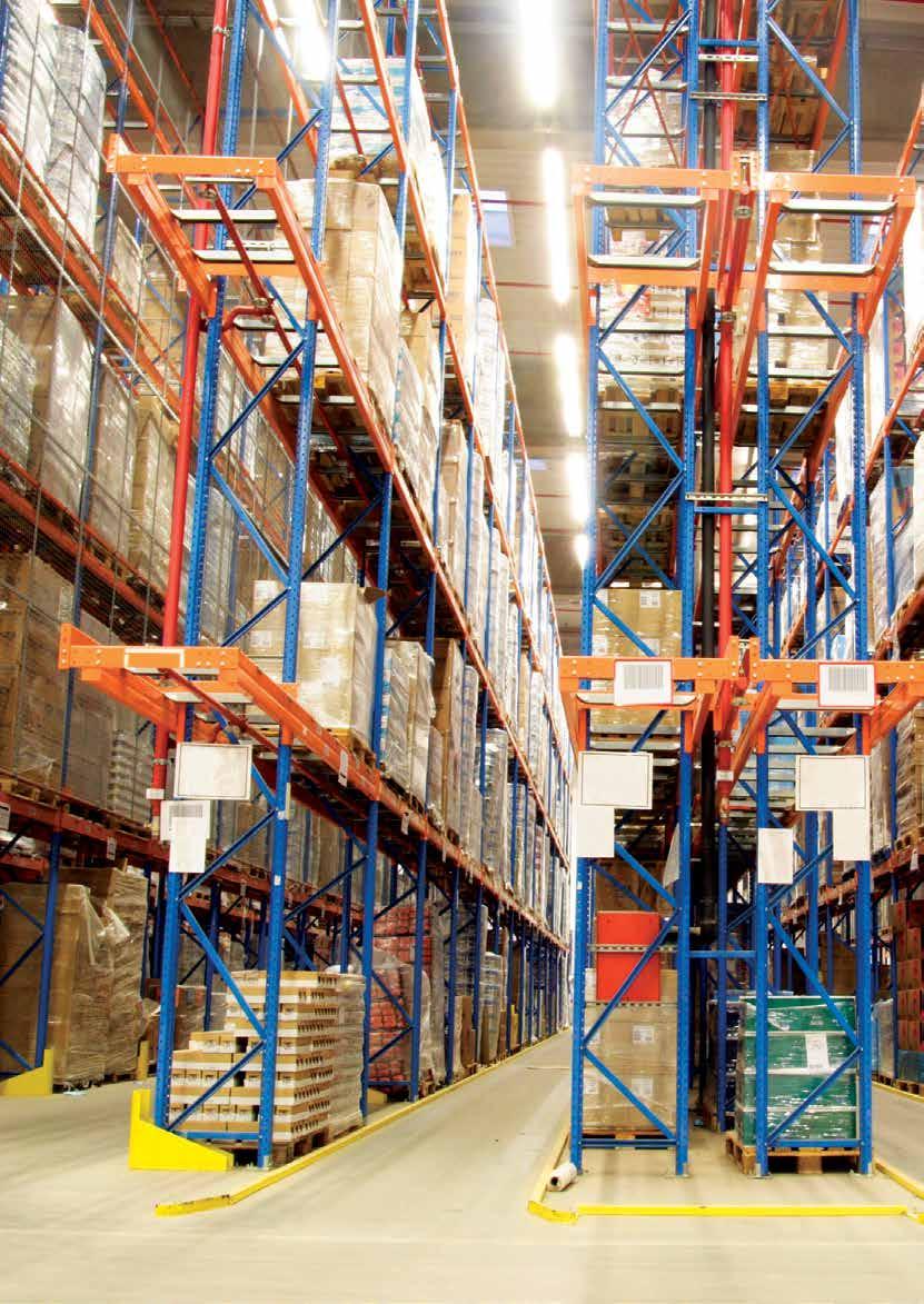 The system is served using specialized high lift fork and rotating material handling devices operating in very narrow aisles.