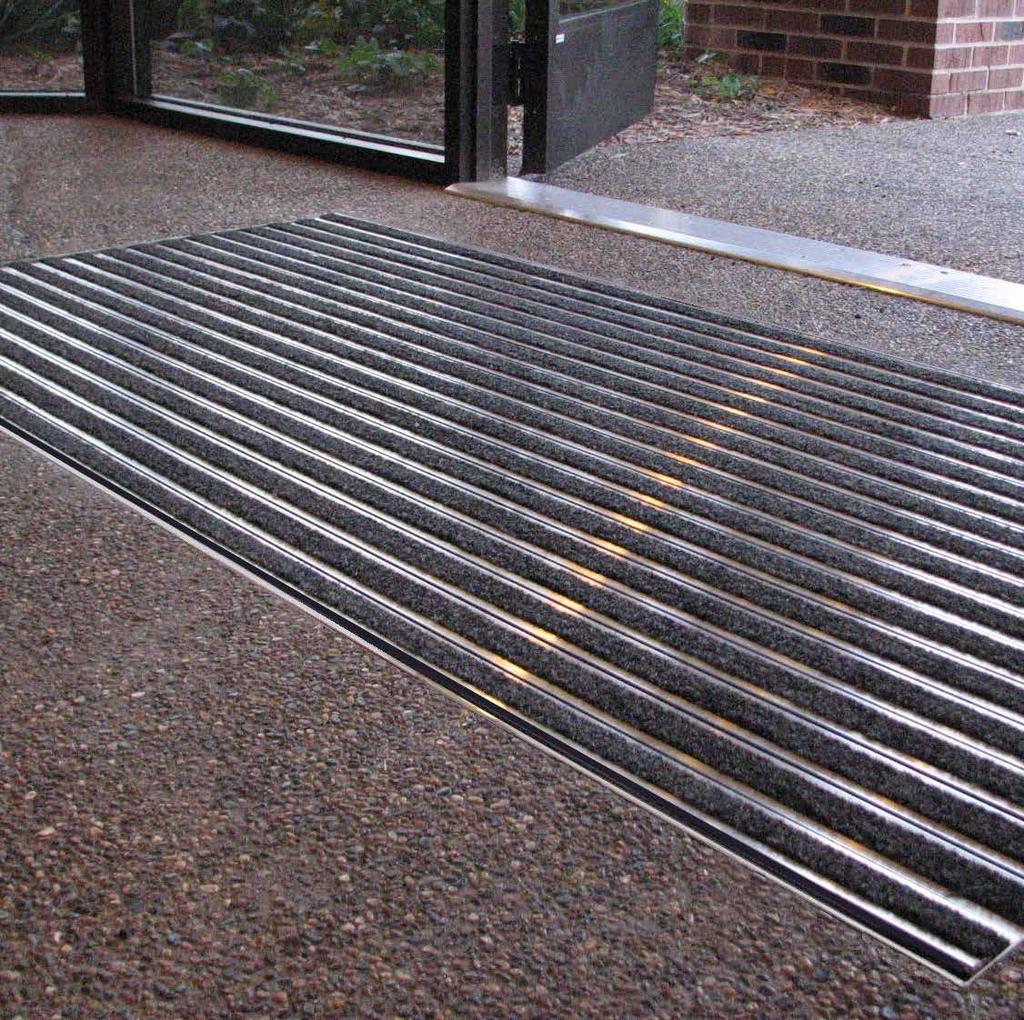 ABOUT OUR REDESIGNED LINE OF MATS AND GRATINGS THE STRONGER RAIL DESIGN OF THE 700 AND 800 ROLL UP MATS PROVIDES A 400 LB PER WHEEL LOAD RATING. CUSTOM SHAPES, CUTOUTS AND SPECIAL FEATURES AVAILABLE.