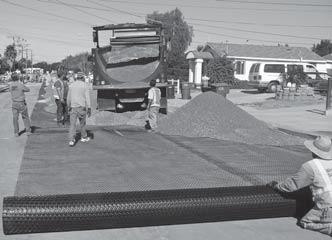 5), unrolling geogrid transversely or perpendicular to the roadway embankment alignment, may be preferred, particularly if lateral spreading and separation of overlaps is a concern (Table 1).