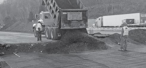 5. Dumping and Spreading Aggregate Fill > Generally, at least 6 in. of compacted aggregate fill is required for the initial lift thickness over a Tensar TriAx Geogrid.