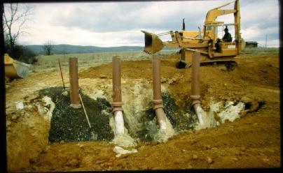 - Backfill: Pipes are surrounded with 1 inch average diameter gravel with a thickness between 8 to 12 inches.