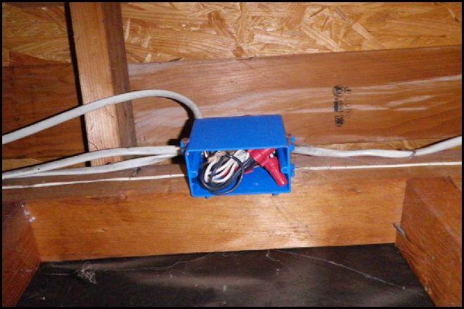 There is overhead wiring that is spanning large open spaces and/or is not properly secured to framing components.
